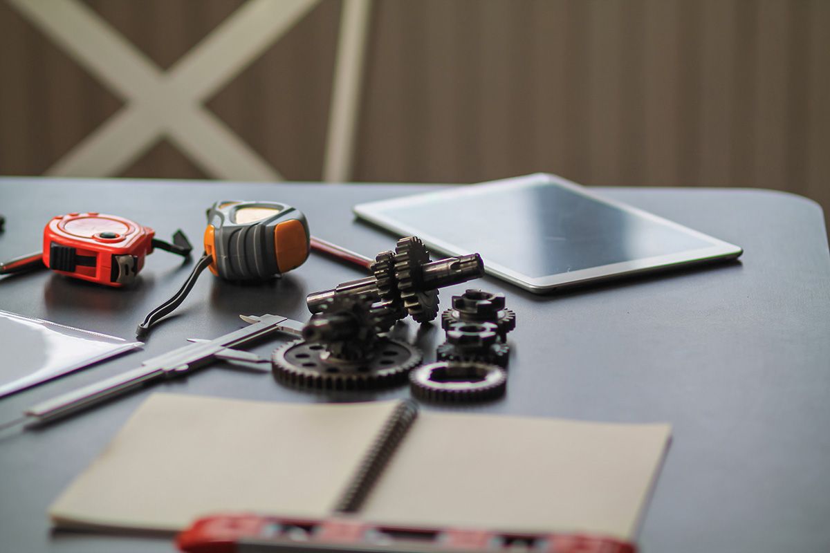 Set of gears on an engineering team workbench